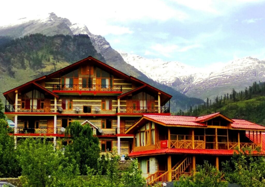 Stay with the backdrop of Himalayas and next to forest of conifer trees