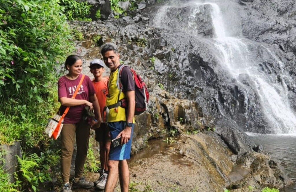 The Author of Blog Rahul Bhusari standing with Family in front of 7 cascade Waterfall — one of Mauritius’ most stunning hiking trail.