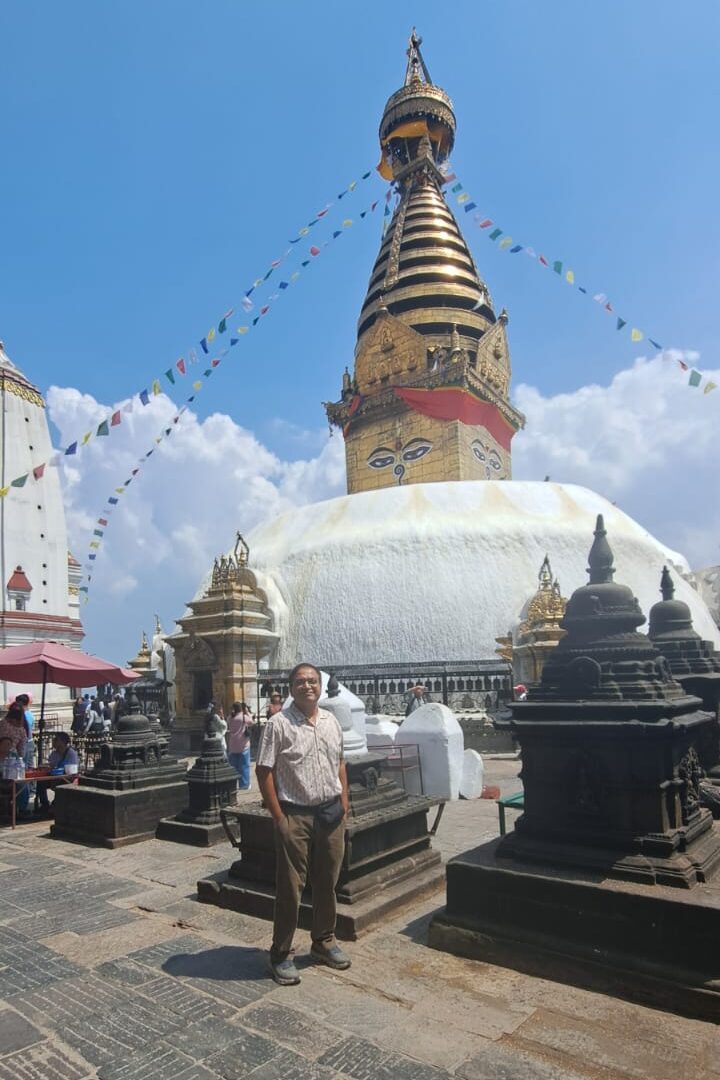 Trekker at Swayambhunath Stupa (Monkey Temple) in Kathmandu, Nepal, before the Annapurna Base Camp Trek.